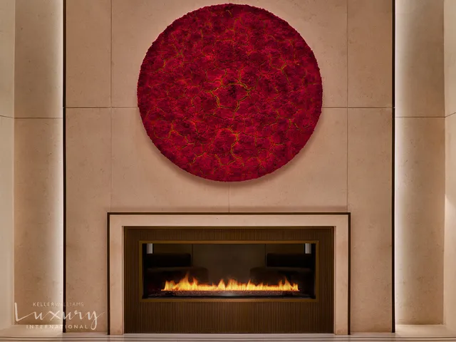 a large living room with fireplace furniture and a large window