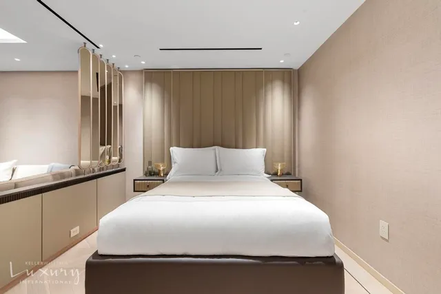 a large bed in a white room