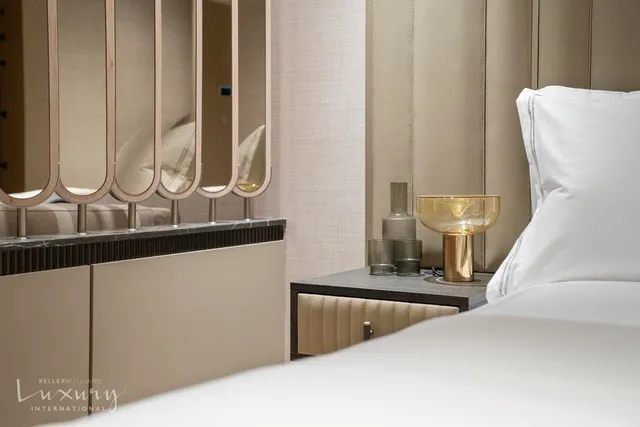 a bathroom with a sink a toilet a mirror and vanity