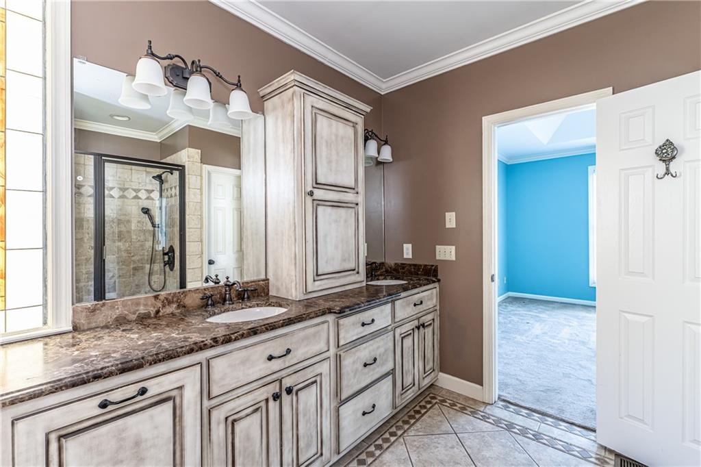 113 Warwick Way Rome, GA 30161 - Photo 23 of 49 a spacious bathroom with a granite countertop sink and a mirror