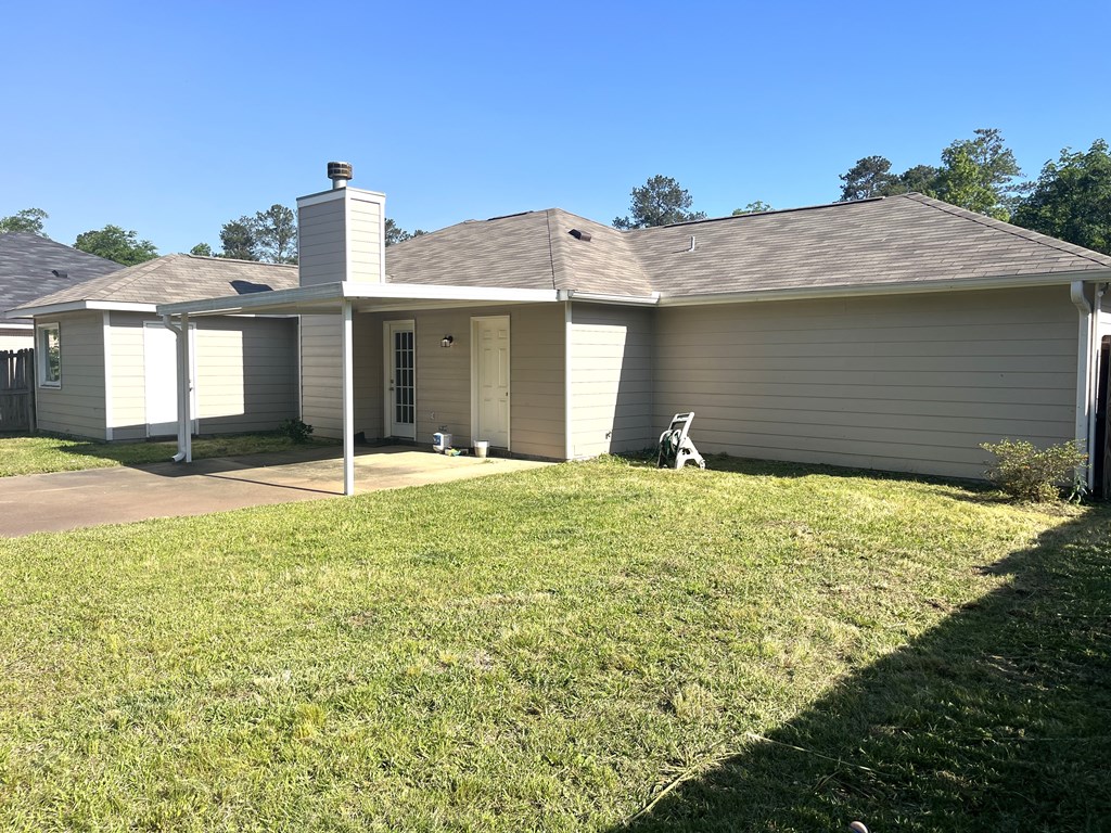 7289 Midland Chase Loop Columbus, GA 31909 - Photo 15 of 19 a front view of a house with a yard