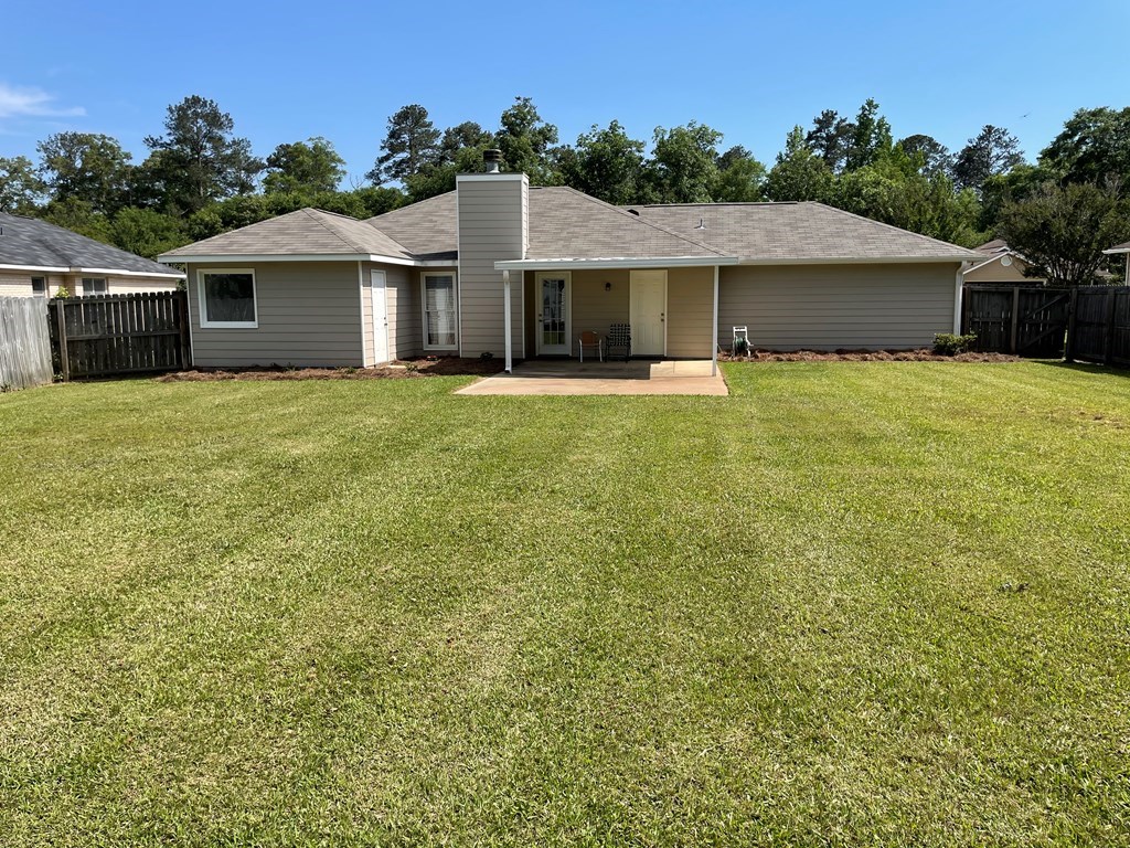 7289 Midland Chase Loop Columbus, GA 31909 - Photo 16 of 19 a front view of a house with a garden