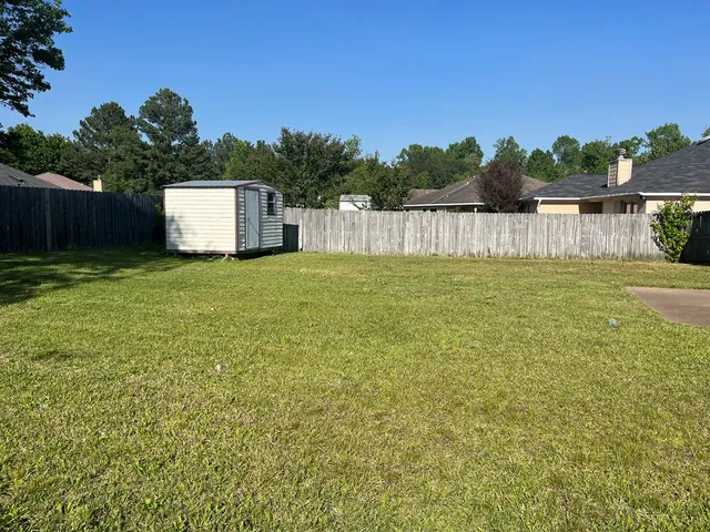 a house view with a garden space
