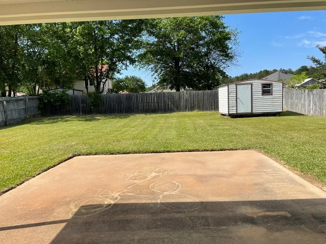 a view of backyard with green space