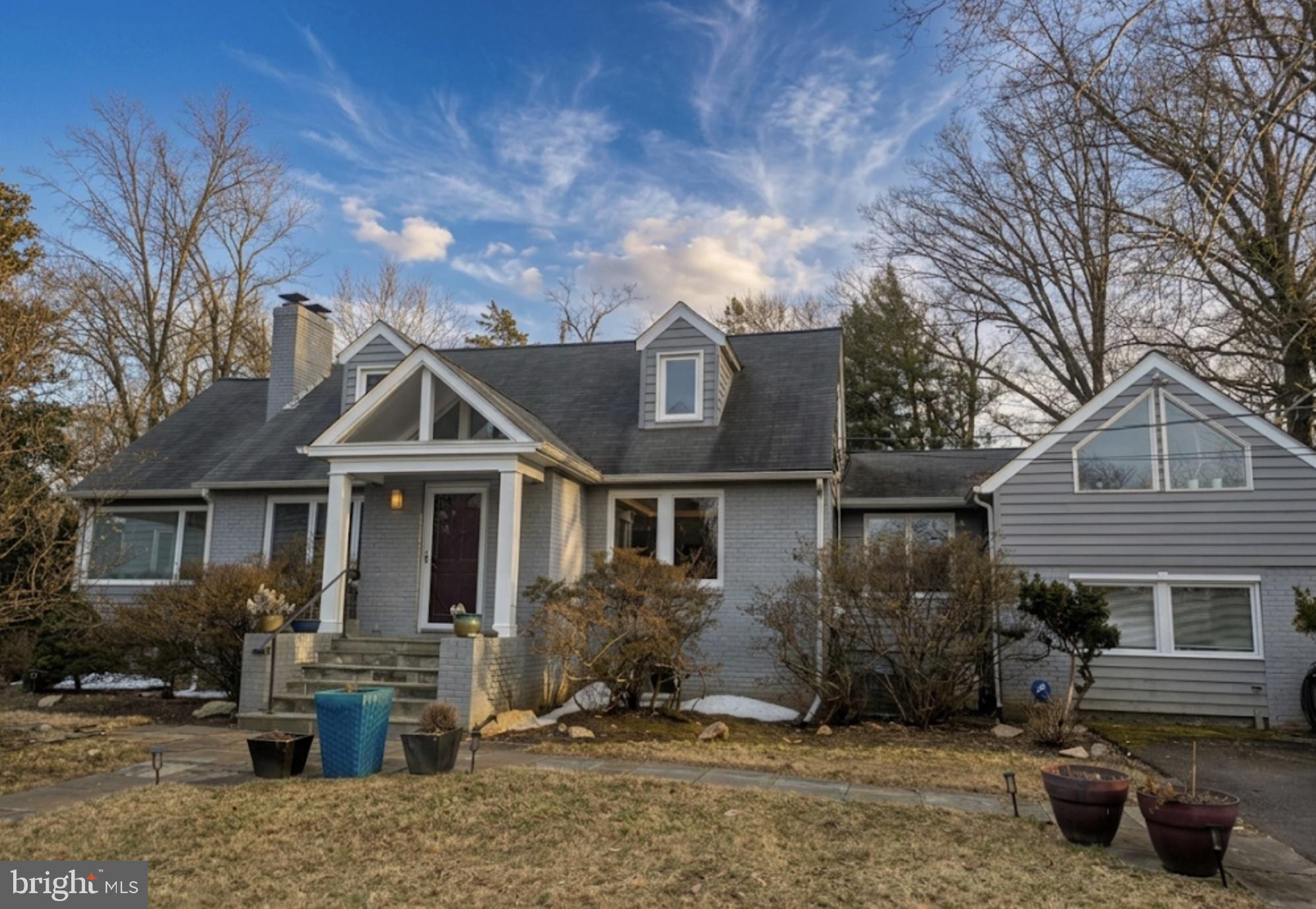 6429 Divine Street McLean, VA 22101 - Photo 1 of 7 a front view of a house with a yard