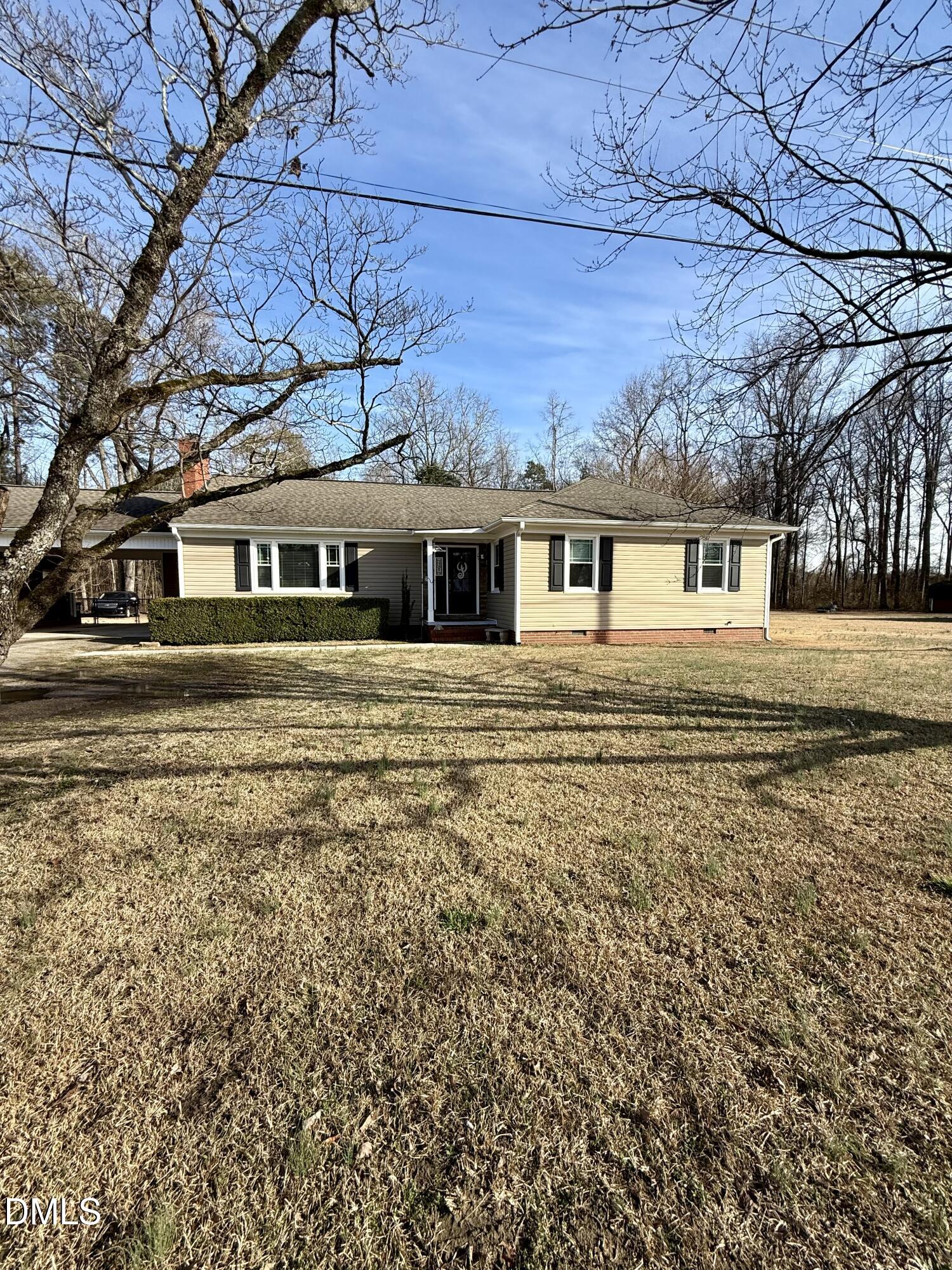 1689 Amelia Church Road Clayton, NC 27520 - Photo 1 of 23 front view of house with a yard