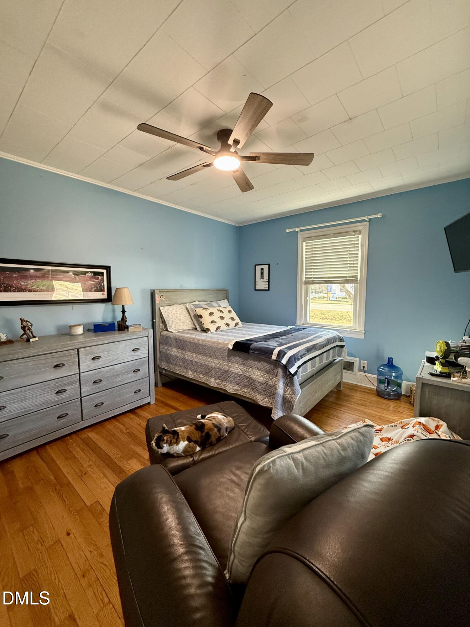 1689 Amelia Church Road Clayton, NC 27520 - Photo 11 of 23 a bedroom with furniture and a ceiling fan
