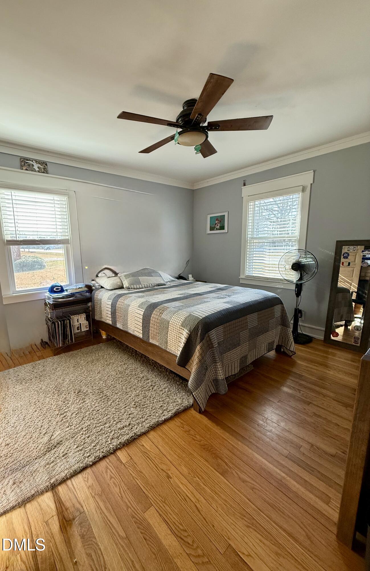 1689 Amelia Church Road Clayton, NC 27520 - Photo 12 of 23 a bedroom with a bed and a chandelier