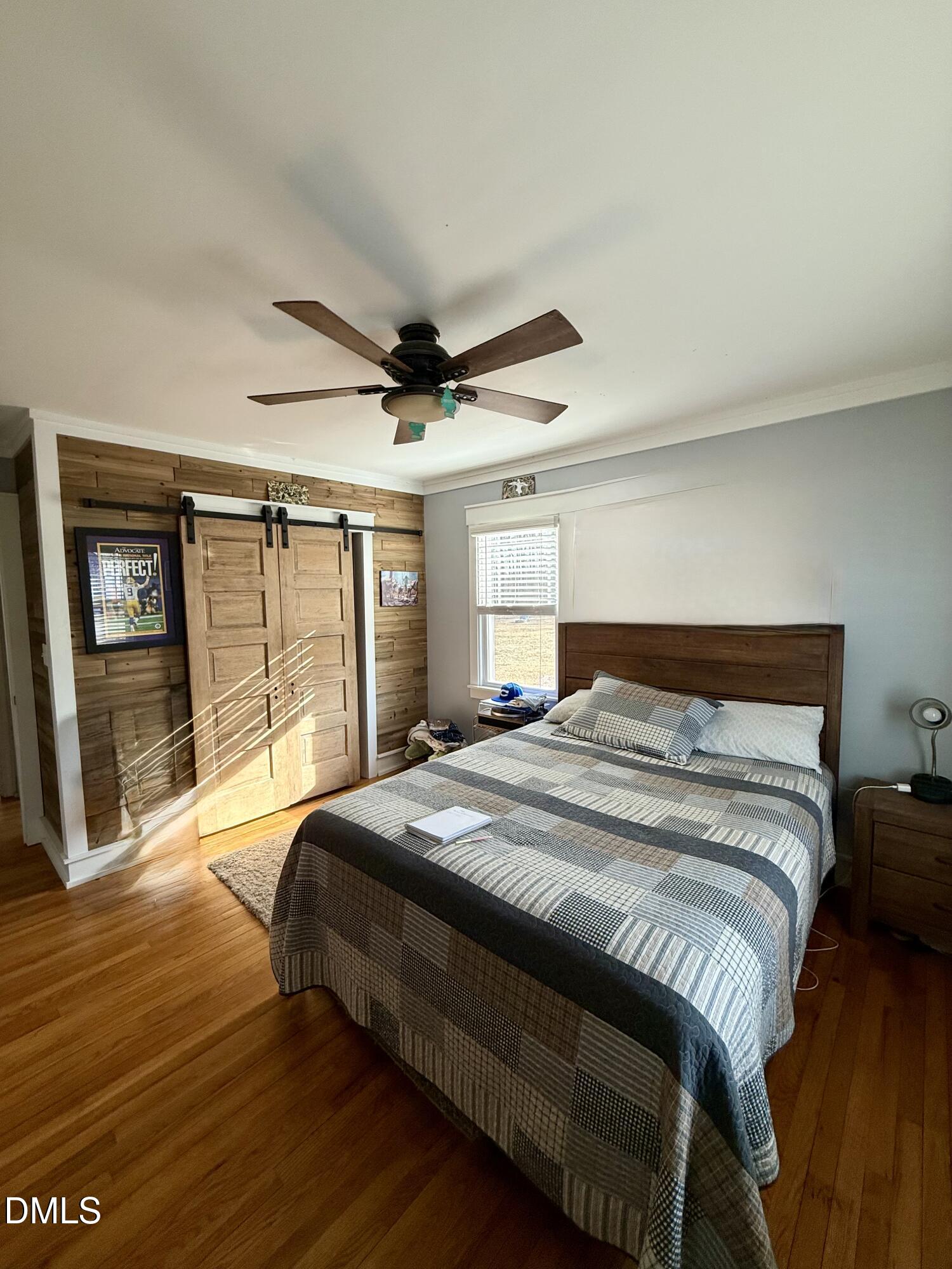 1689 Amelia Church Road Clayton, NC 27520 - Photo 13 of 23 a bedroom with a large bed and a large window