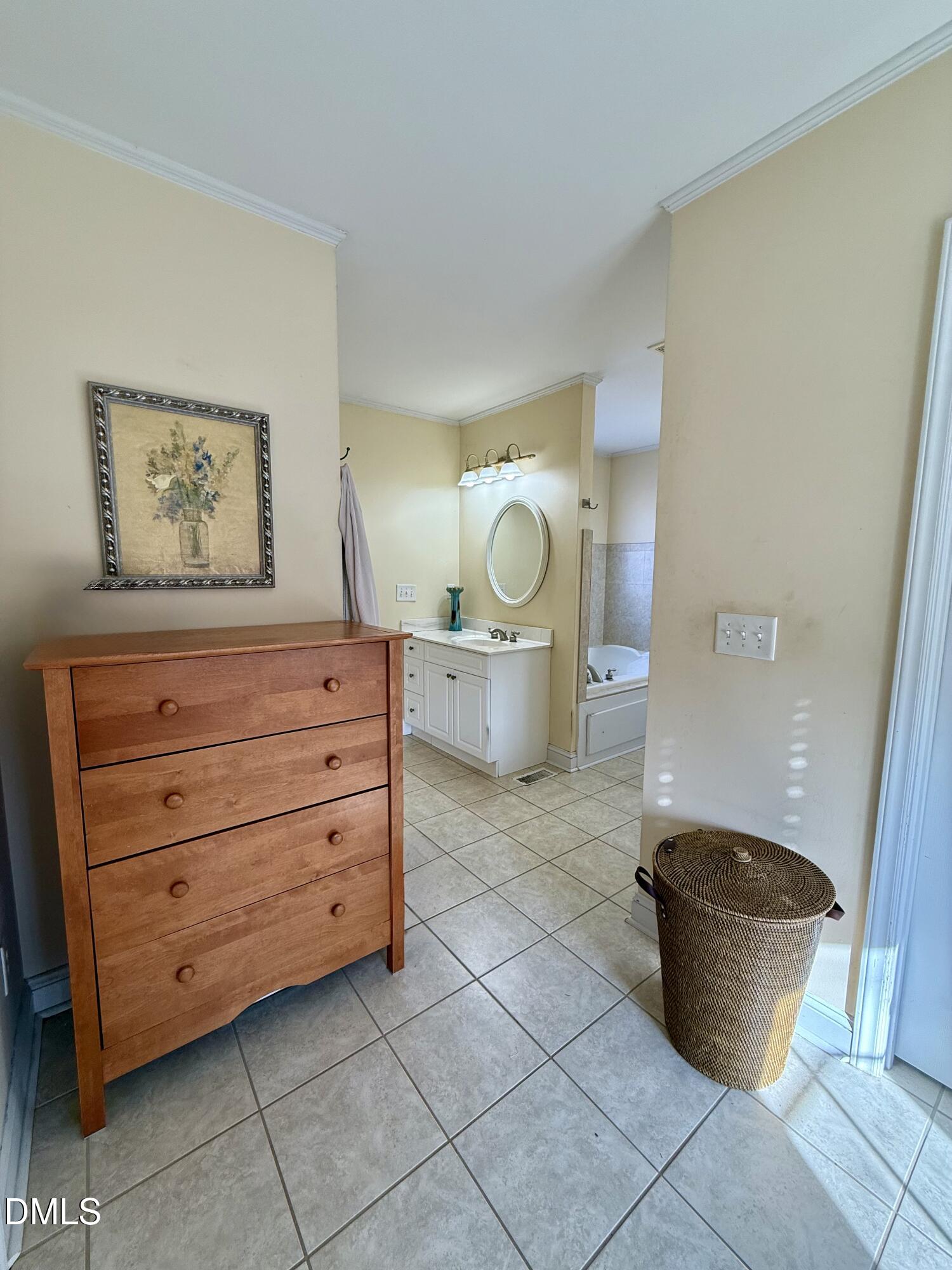 1689 Amelia Church Road Clayton, NC 27520 - Photo 19 of 23 a room with a furniture and a potted plant