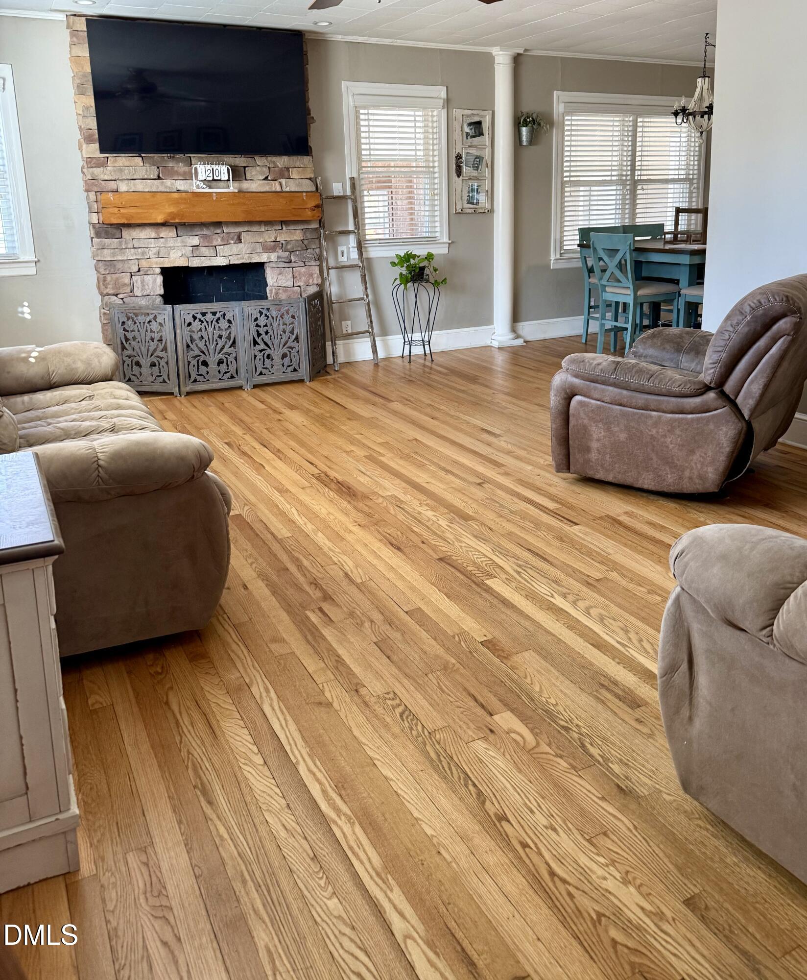 1689 Amelia Church Road Clayton, NC 27520 - Photo 5 of 23 a living room with furniture and a fireplace
