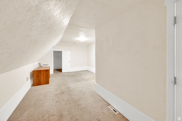 501 Canyon Road Ogden, UT 84404 - Photo 13 of 30 Carpeted room with sloped ceilings, recessed lighting, and a neutral color palette
