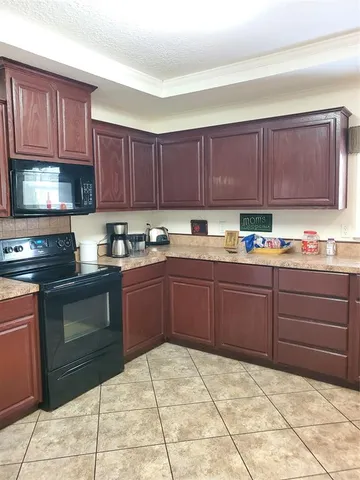 a kitchen with a cabinets and appliances