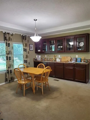 a dinning table and chairs in a room