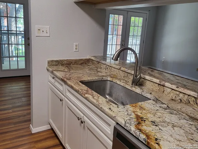 a kitchen with a stove and a sink