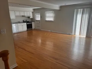 a kitchen with granite countertop a stove and a refrigerator