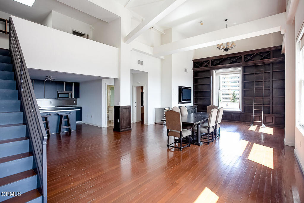 257 South Spring Street, Unit PHE Los Angeles, CA 90012 - Photo 6 of 32 a dining room with furniture entryway and wooden floor
