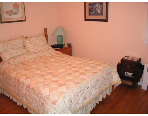 815 Boston Road Billerica, MA 01821 - Photo 7 of 7 a bedroom with a bed and wooden floor