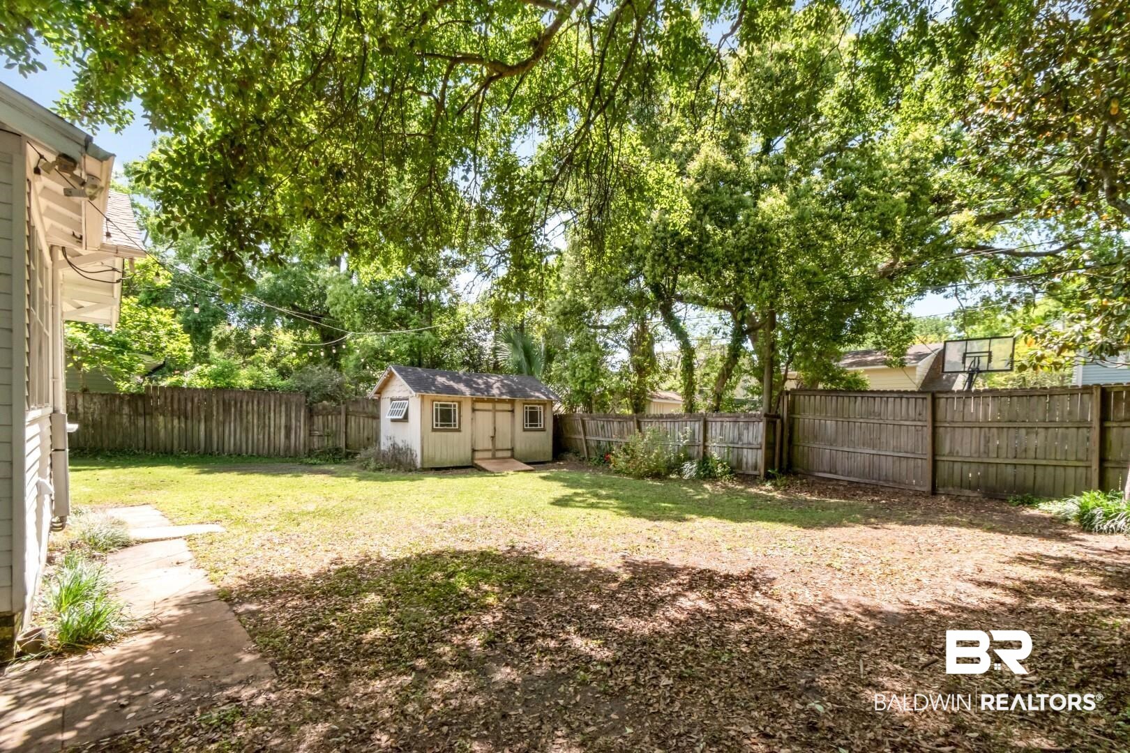 10 Macy Place Mobile, AL 36604 - Photo 36 of 43 Fenced backyard featuring a storage unit