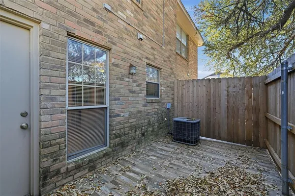 a view of outdoor space and brick wall