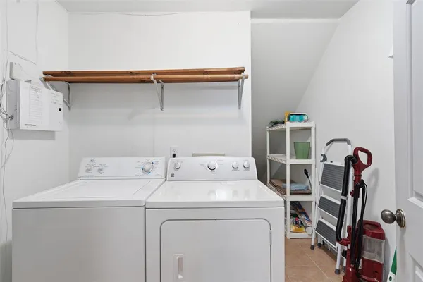 a utility room with dryer and washer