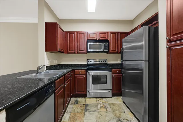a kitchen with a sink and a window