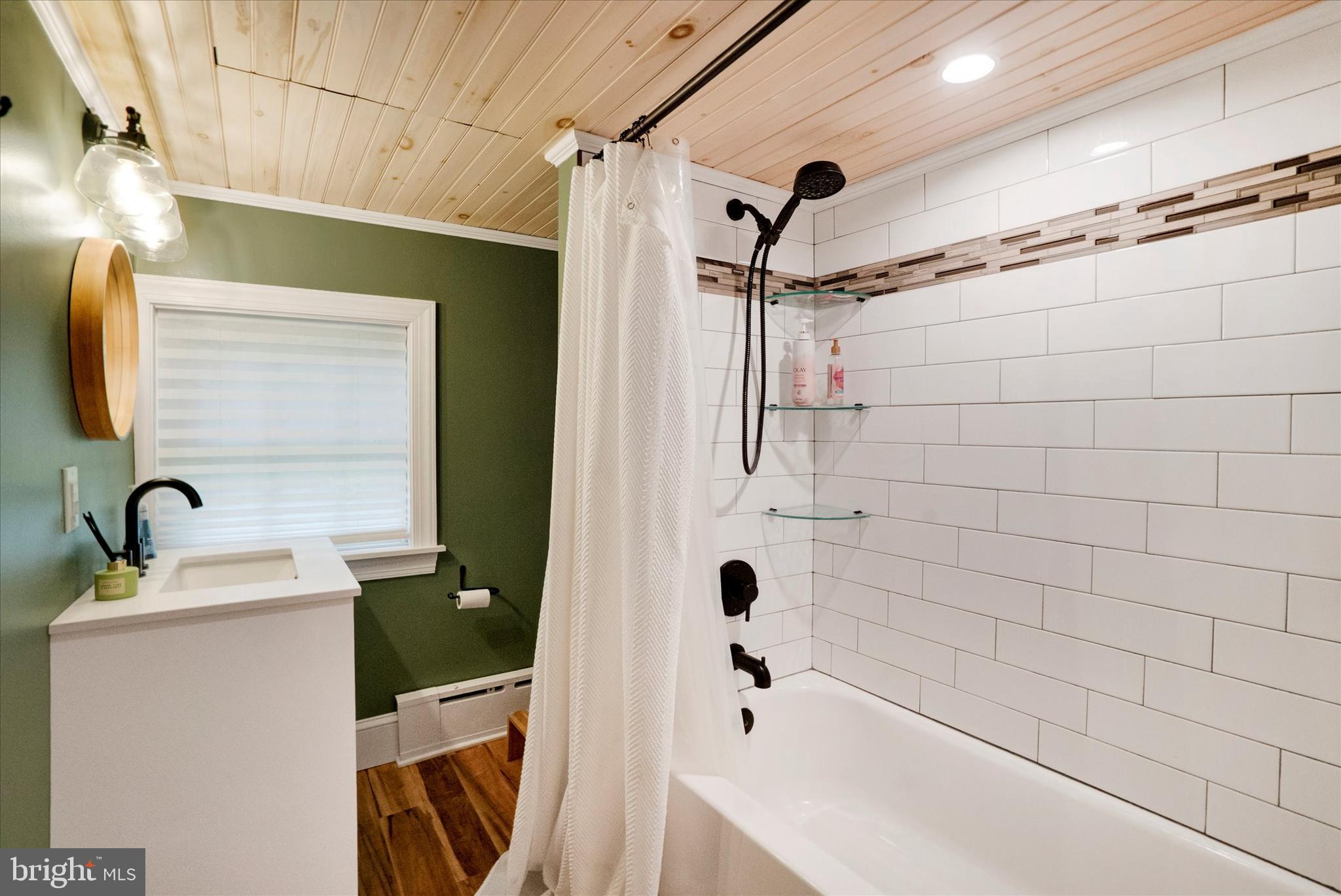 53 Main Street Oley, PA 19547 - Photo 21 of 26 a bathroom with a sink a toilet and shower