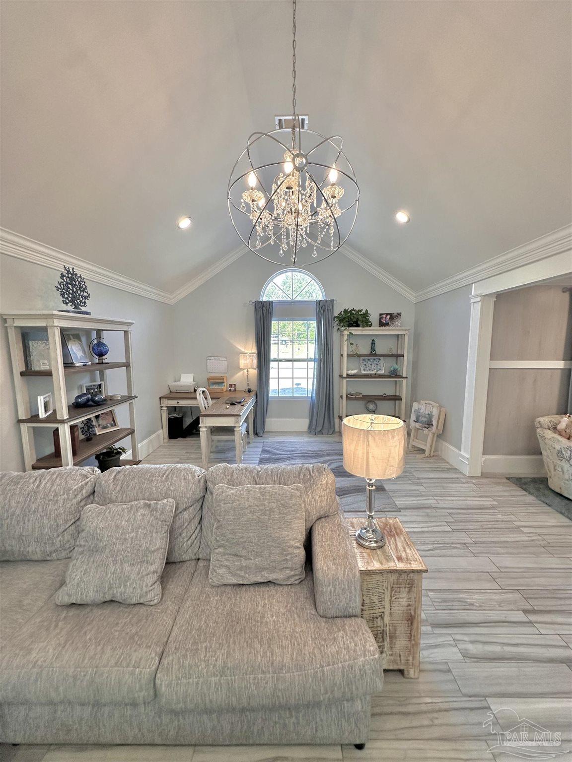 3097 Fayal Drive Pensacola, FL 32526 - Photo 11 of 46 a living room with furniture chandelier and wooden floor