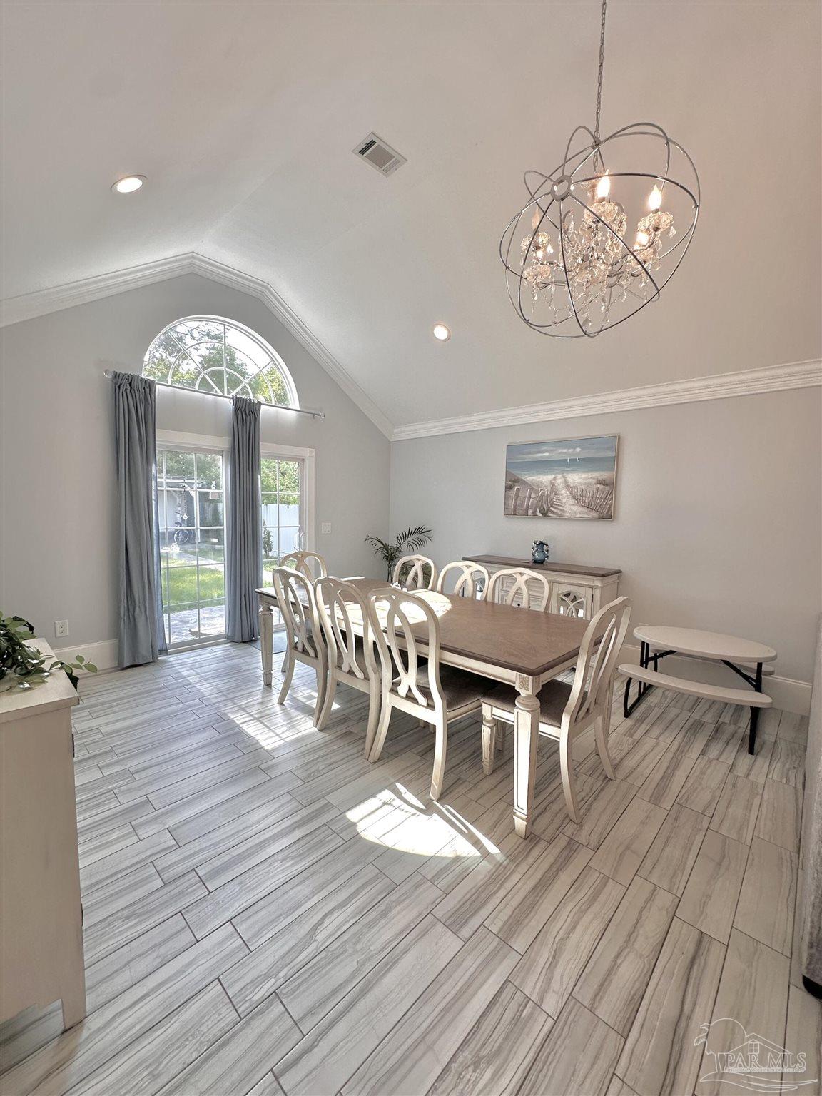 3097 Fayal Drive Pensacola, FL 32526 - Photo 16 of 46 a view of a dining room with furniture window and wooden floor