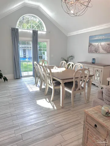 a view of a kitchen with furniture and a sink
