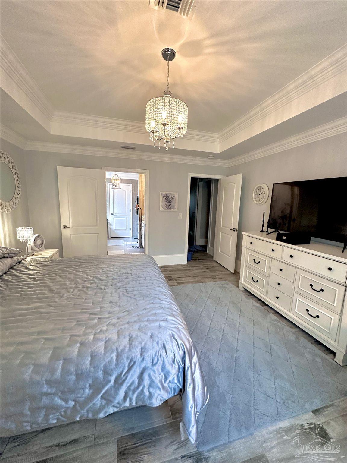 3097 Fayal Drive Pensacola, FL 32526 - Photo 22 of 46 a spacious bedroom with a bed and a flat screen tv