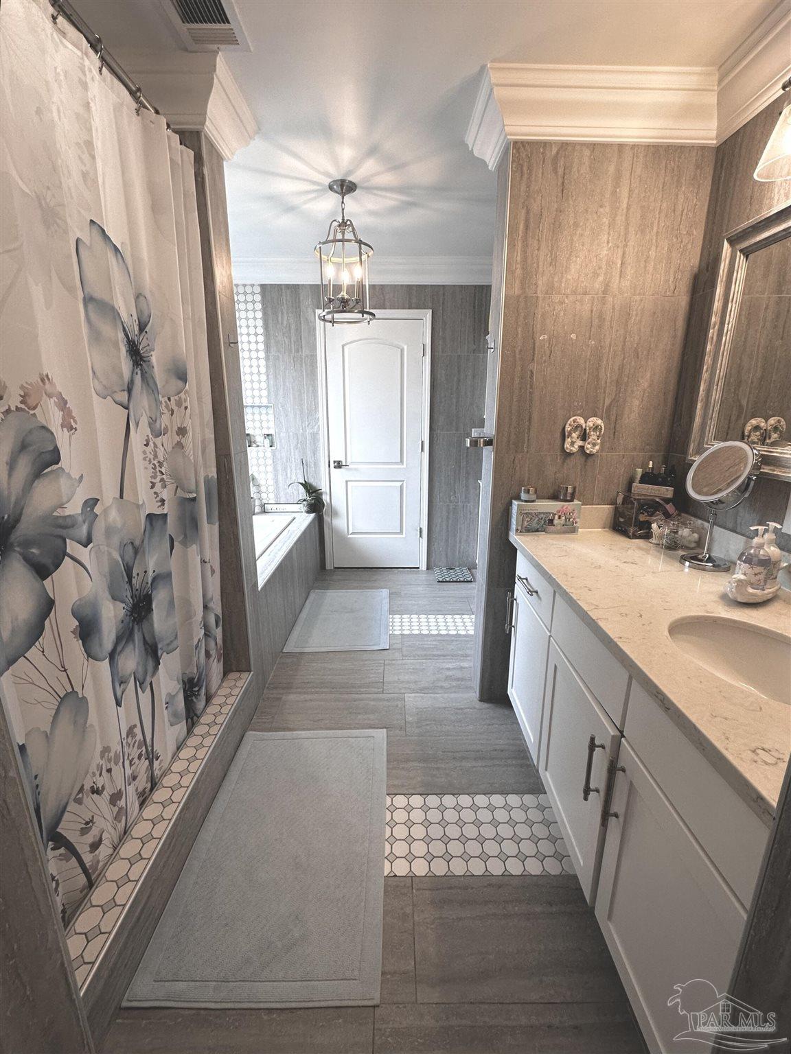 3097 Fayal Drive Pensacola, FL 32526 - Photo 23 of 46 a bathroom with a sink a toilet a mirror and shower