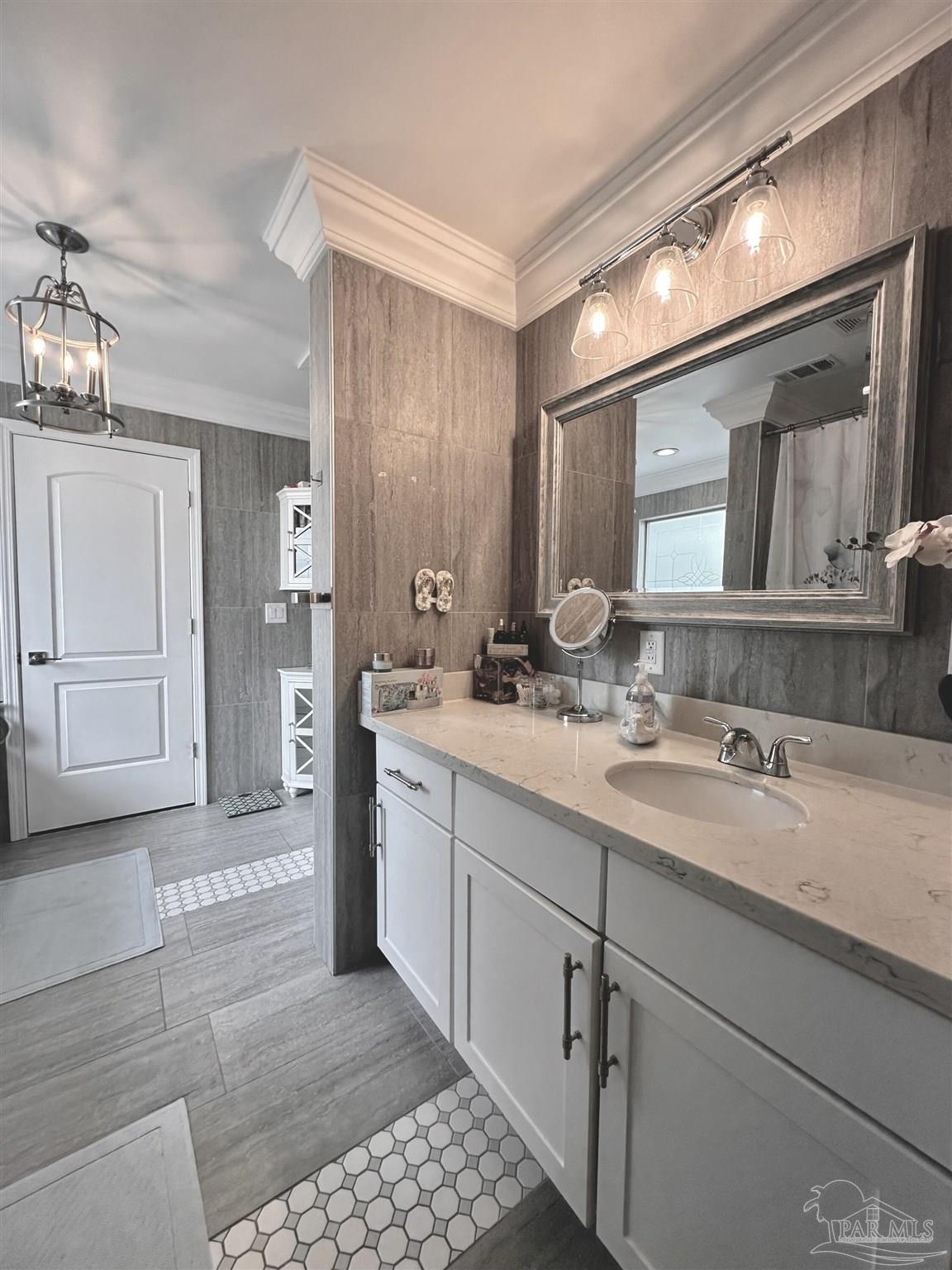 3097 Fayal Drive Pensacola, FL 32526 - Photo 24 of 46 a bathroom with a sink and a mirror