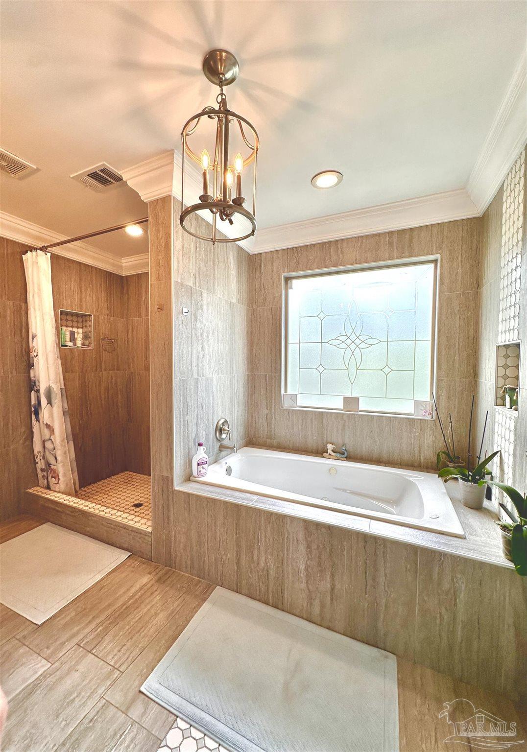 3097 Fayal Drive Pensacola, FL 32526 - Photo 25 of 46 a spacious bathroom with a tub and a large mirror