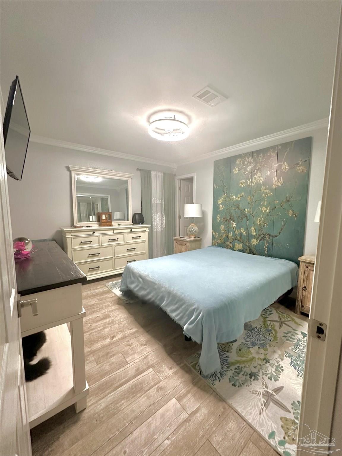 3097 Fayal Drive Pensacola, FL 32526 - Photo 26 of 46 a bedroom with a bed and glass walk in closet