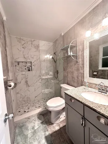 a bedroom with a bed and a cabinets