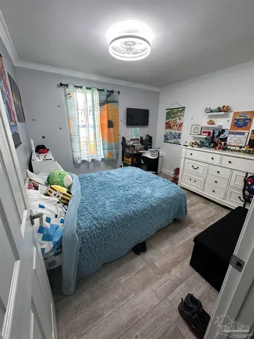 a bedroom with a bed and window