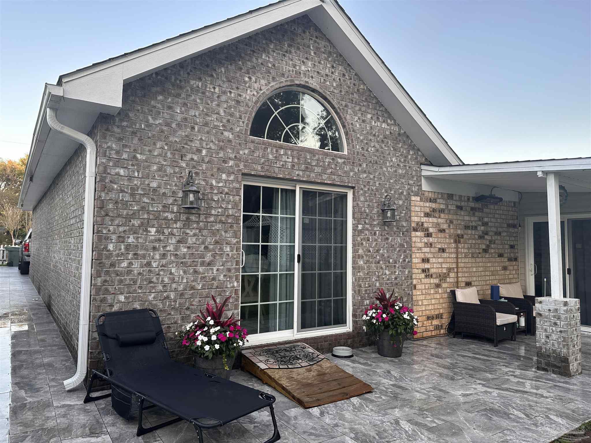 3097 Fayal Drive Pensacola, FL 32526 - Photo 36 of 46 a front view of a house with outdoor seating