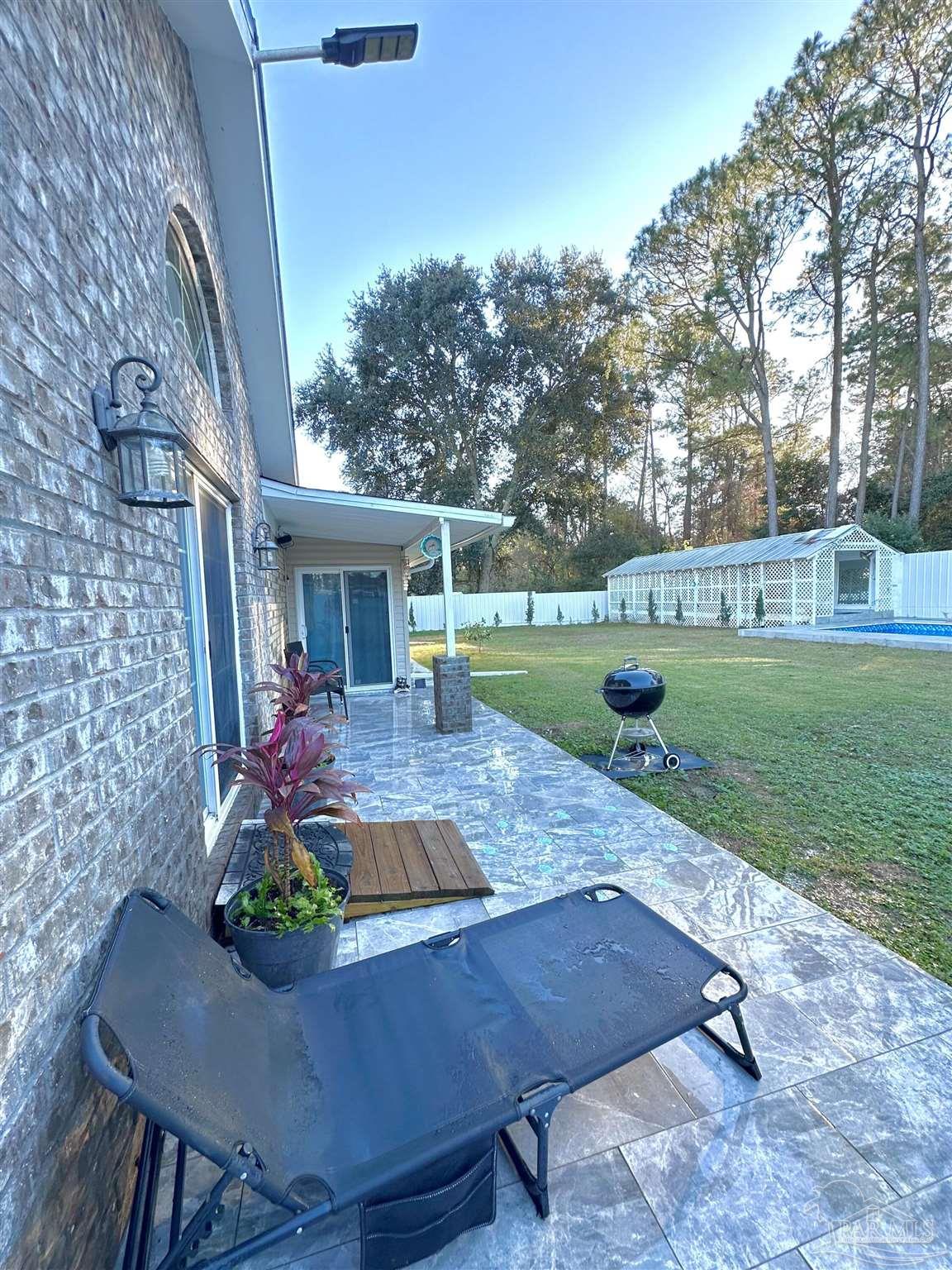 3097 Fayal Drive Pensacola, FL 32526 - Photo 37 of 46 a front view of a house with garden