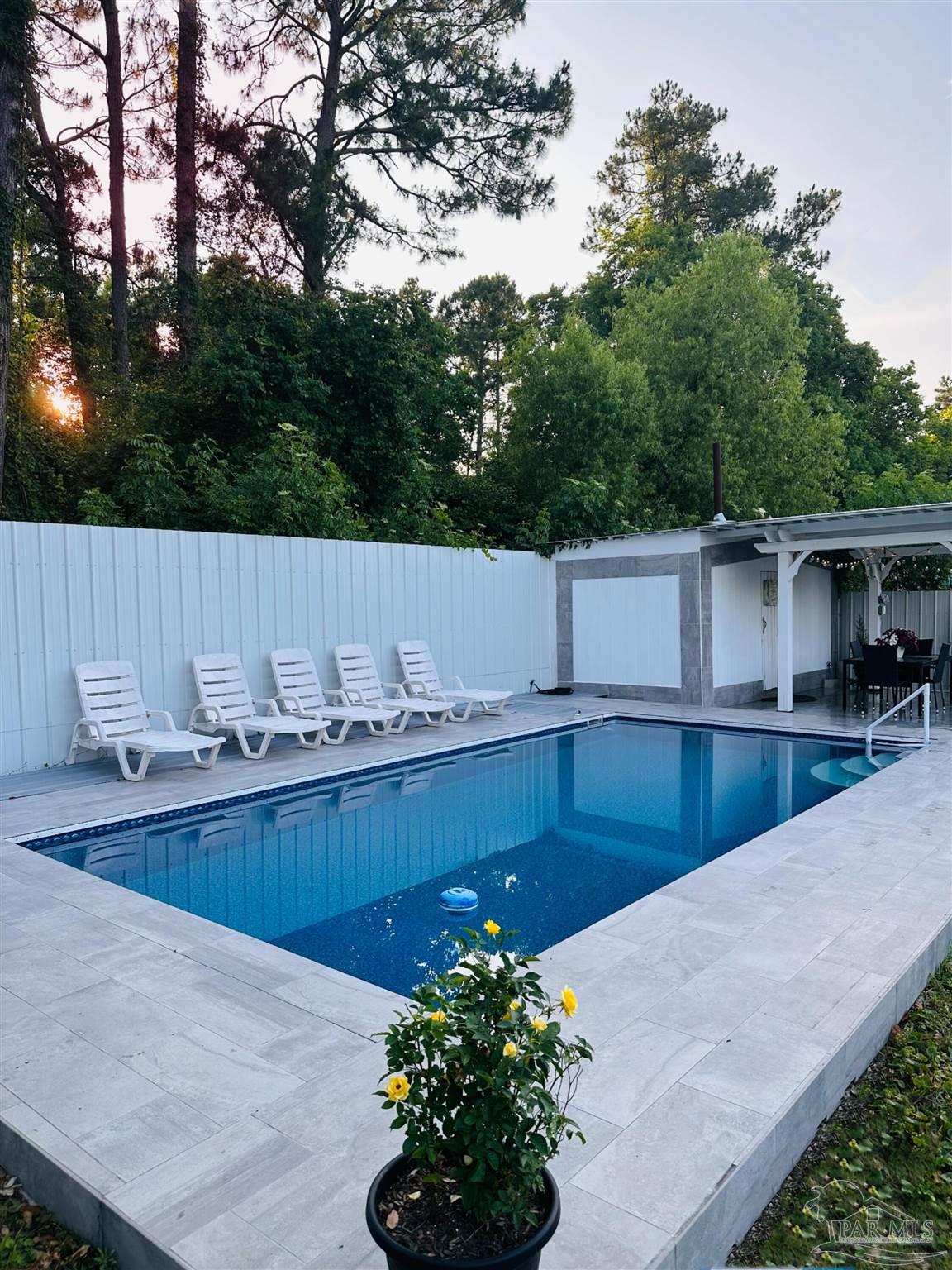 3097 Fayal Drive Pensacola, FL 32526 - Photo 40 of 46 a view of a backyard with a tub and trees