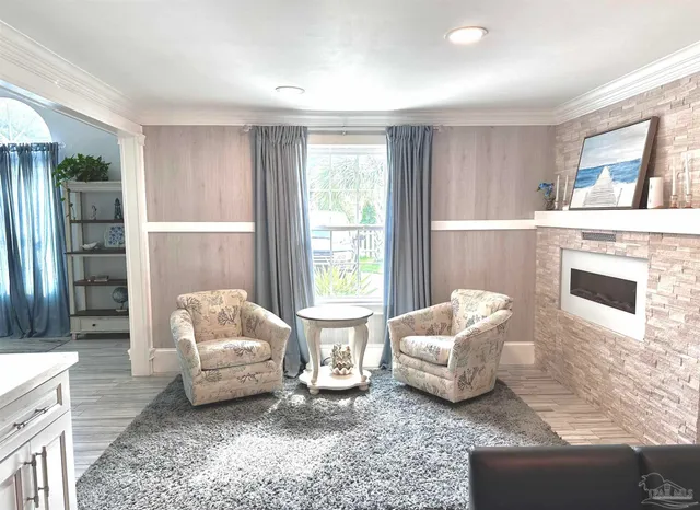 a living room with a couch and a dining table