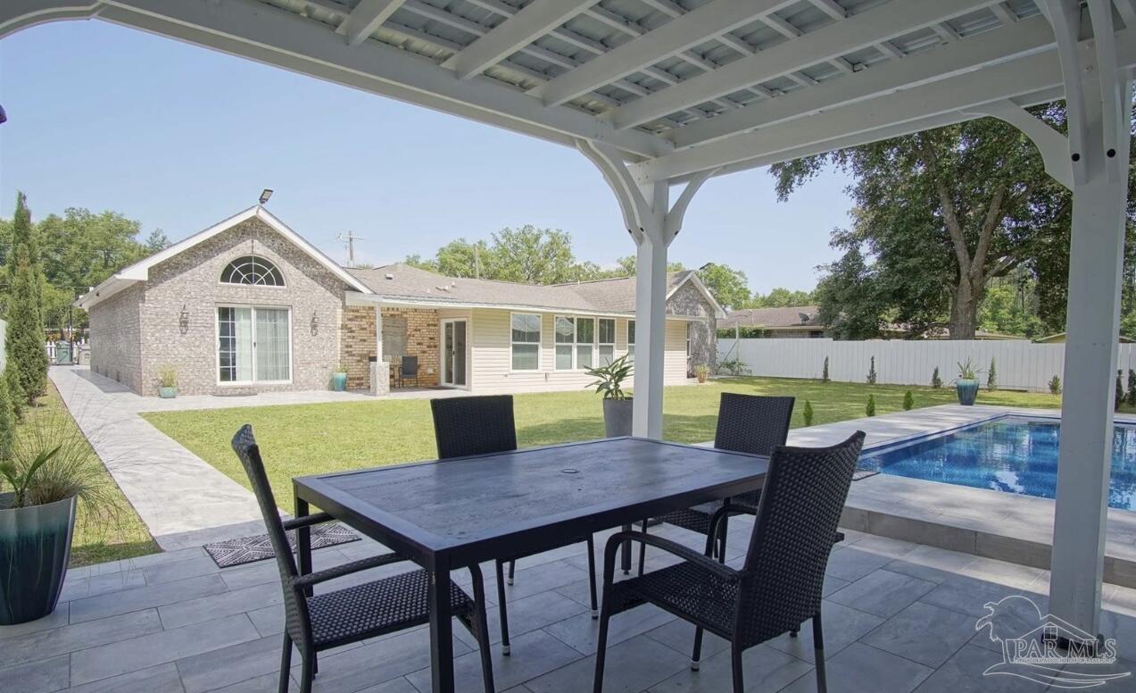 3097 Fayal Drive Pensacola, FL 32526 - Photo 44 of 46 a view of a dining table and chairs in the patio