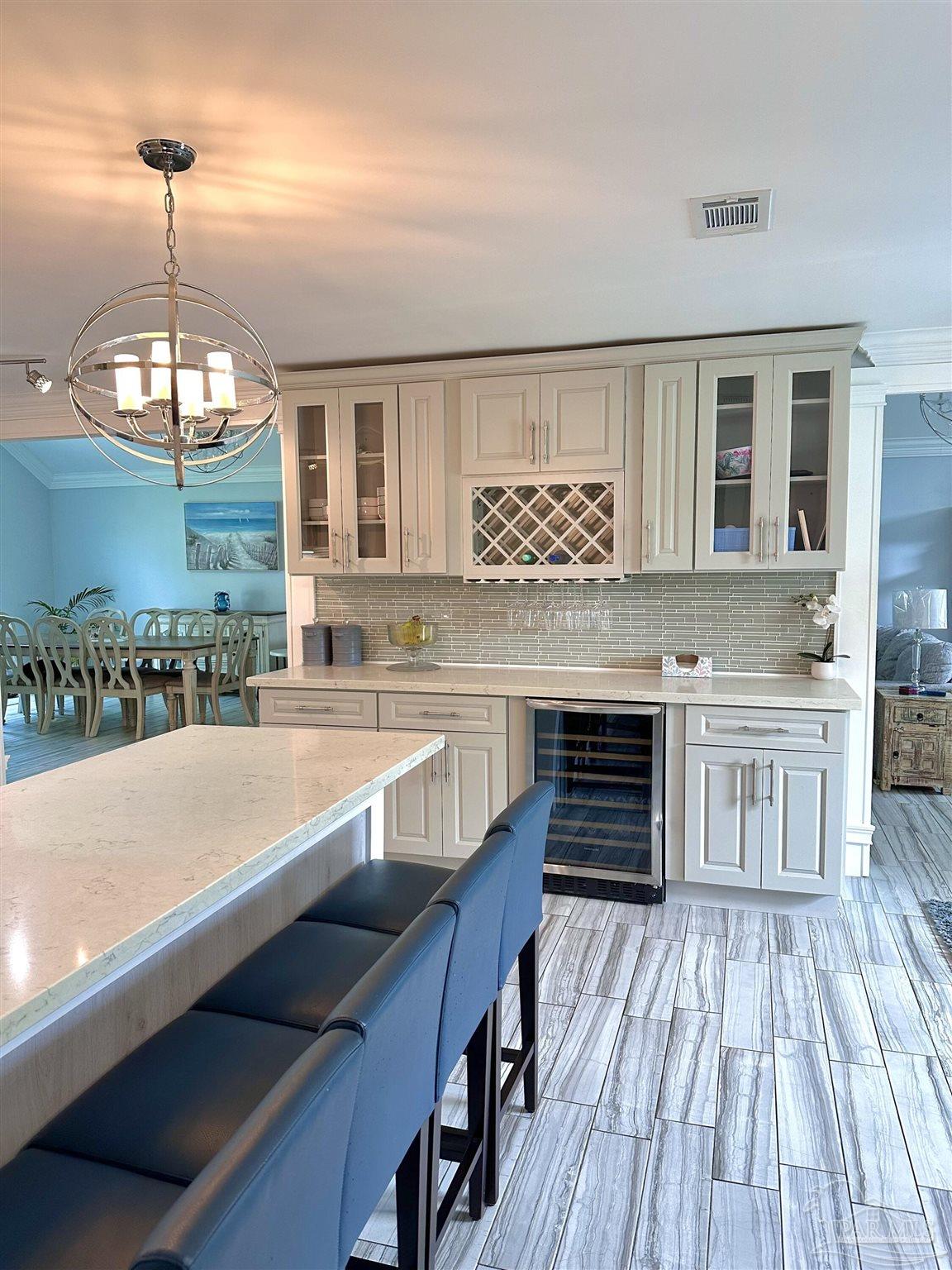3097 Fayal Drive Pensacola, FL 32526 - Photo 9 of 46 a open kitchen with stainless steel appliances granite countertop a stove and a wooden floors