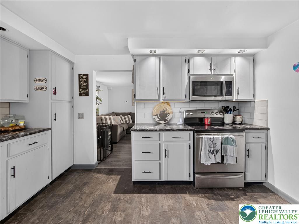 2628 Levans Road Coplay, PA 18037 - Photo 20 of 54 A well-appointed culinary space featuring bright cabinetry and durable flooring connects seamlessly to the living area.