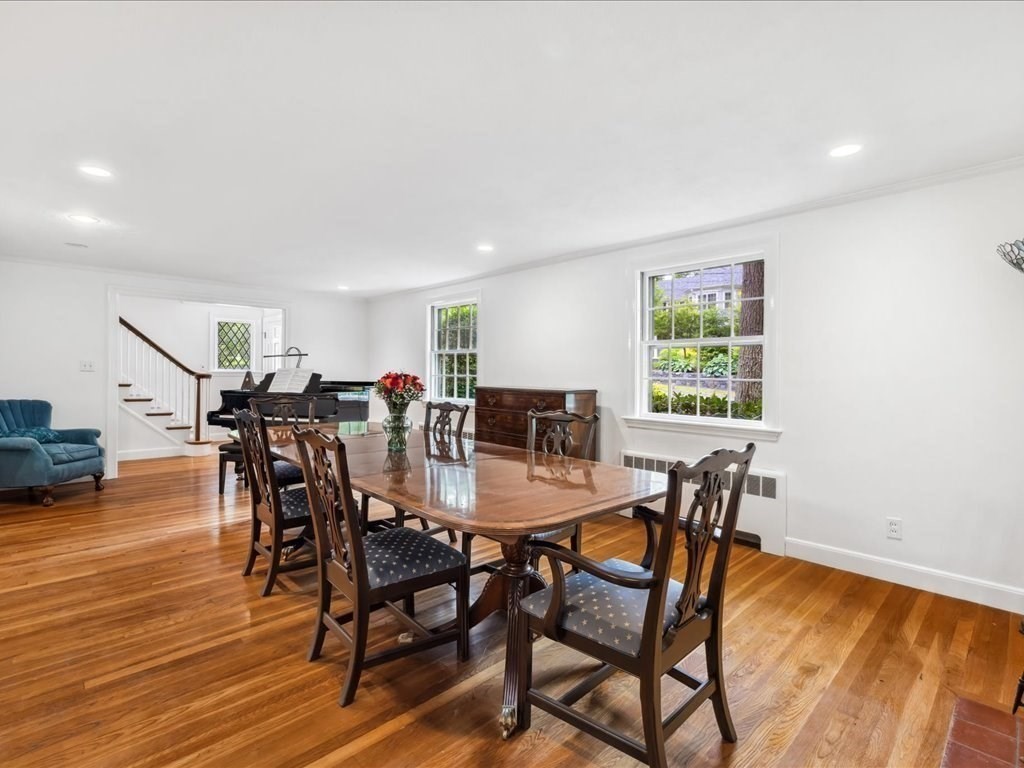 234 Lowell Road Wellesley, MA 02481 - Photo 4 of 30 a view of a dining room with furniture and wooden floor