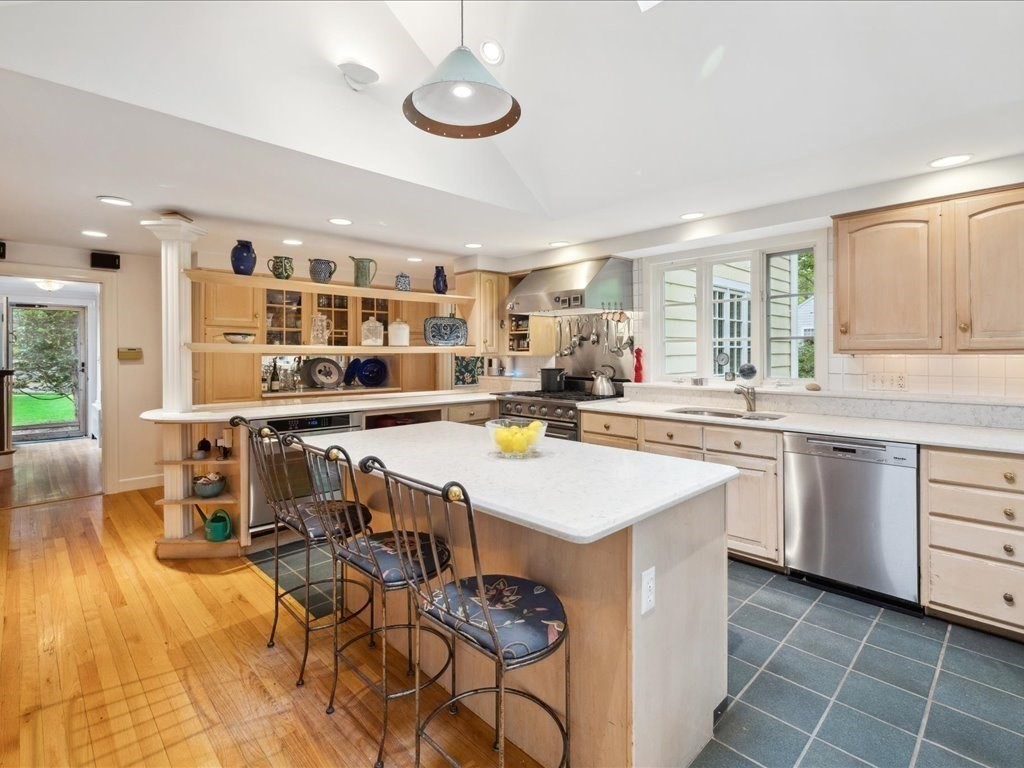 234 Lowell Road Wellesley, MA 02481 - Photo 10 of 30 a kitchen with counter and kitchen island