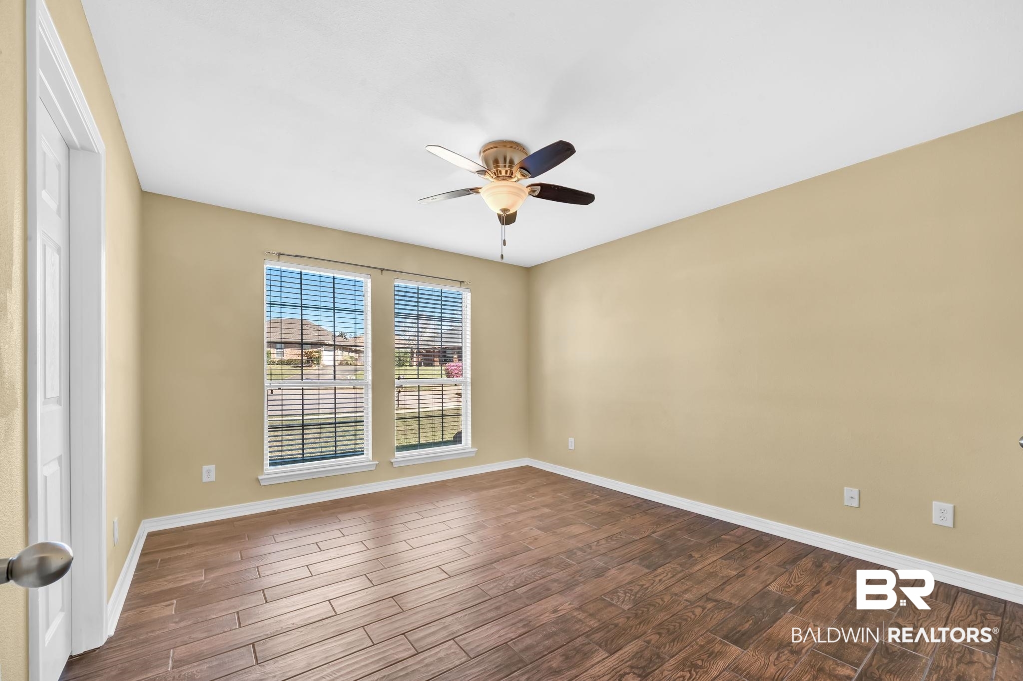 16444 Hamlet Lane Foley, AL 36535 - Photo 36 of 49 Unfurnished room with dark wood finished floors, baseboards, and a ceiling fan
