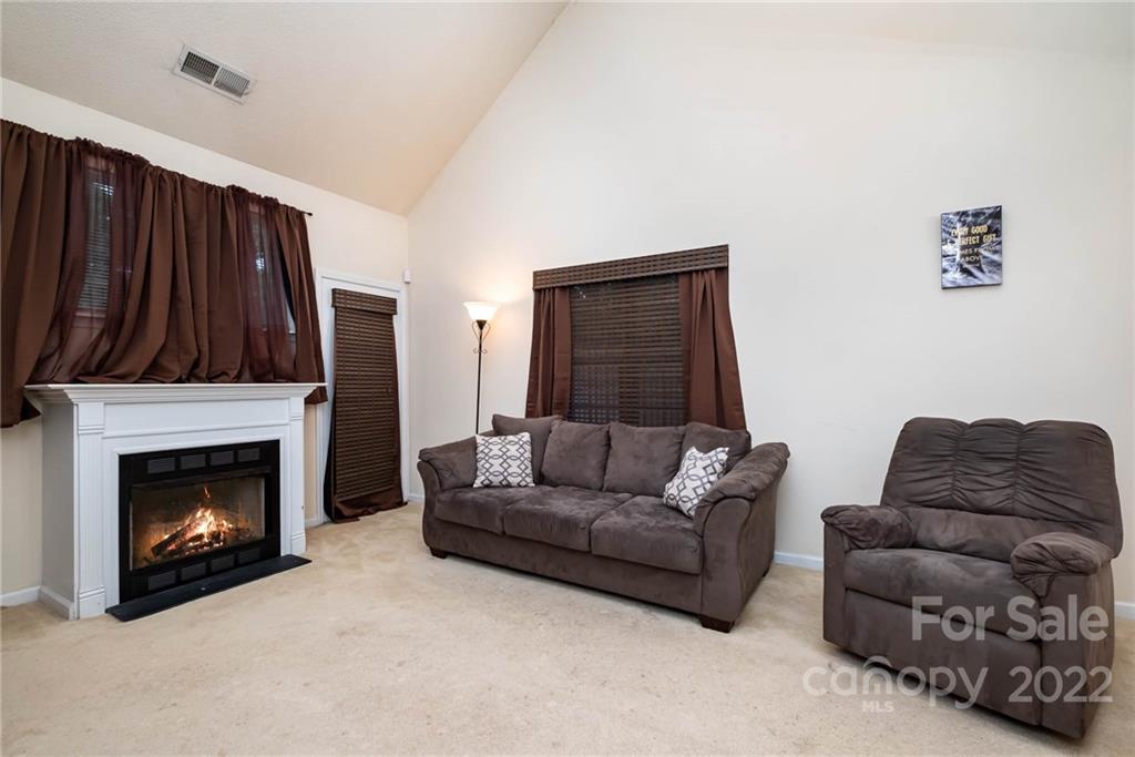 16865 Timber Crossing Road Charlotte, NC 28213 - Photo 12 of 36 a living room with furniture and a fireplace