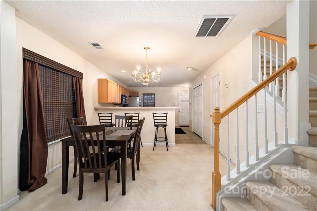 16865 Timber Crossing Road Charlotte, NC 28213 - Photo 13 of 36 a view of a dining room with furniture