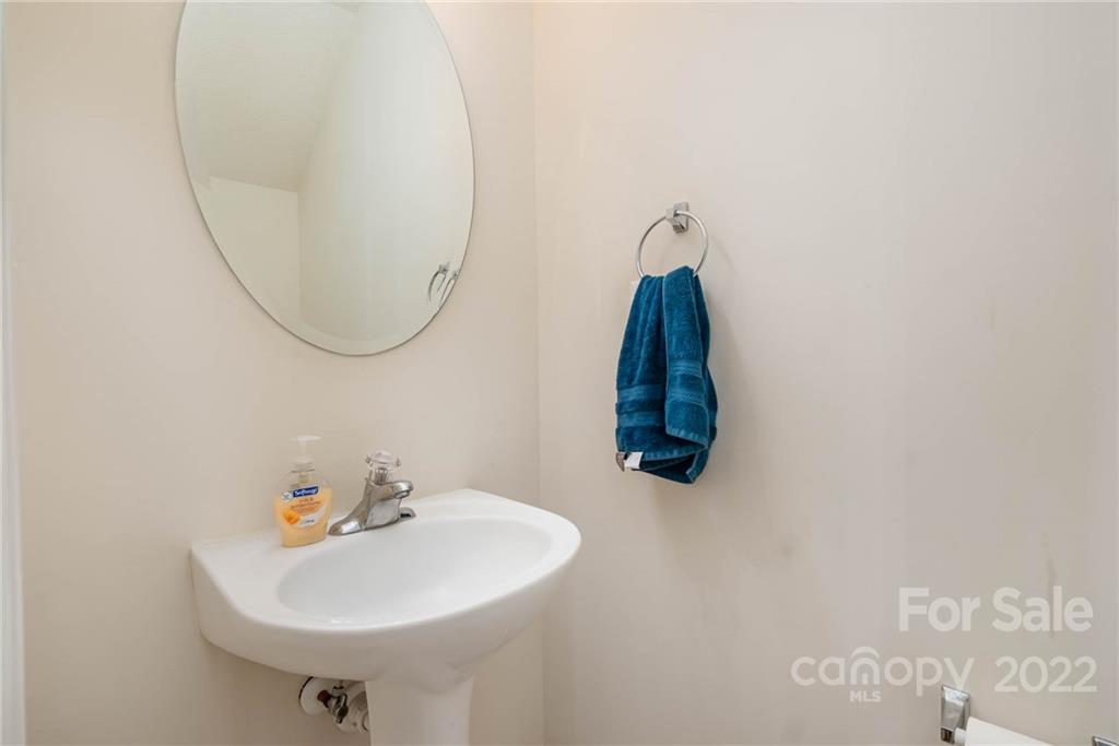 16865 Timber Crossing Road Charlotte, NC 28213 - Photo 24 of 36 a bathroom with a sink and a mirror